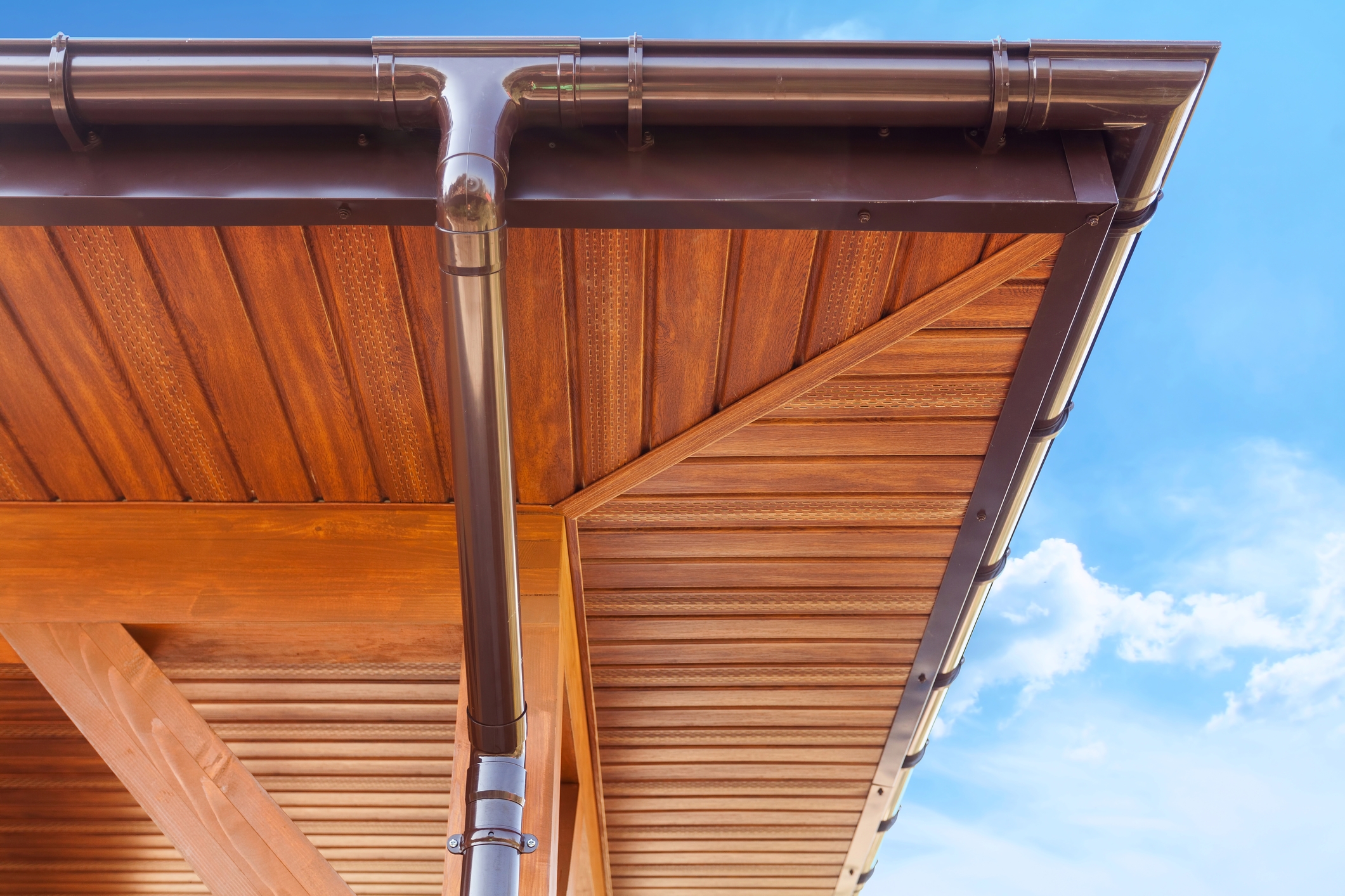 Copper gutter system — luxury exterior detail viewed from below